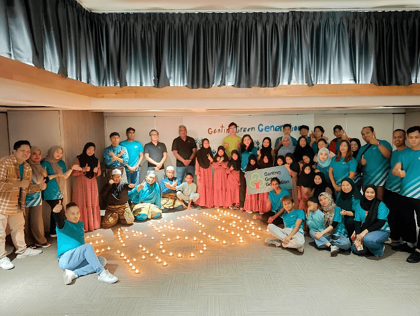 The Earth Hour photo session with G3 volunteers and the management team of GENM, alongside children from Rumah Titian Kaseh